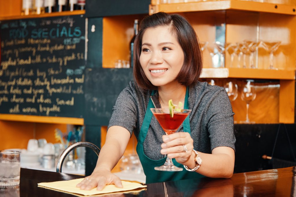 Bartender cleaning bar counter